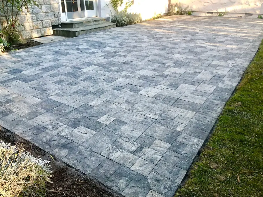 Gray interlocking paver patio installed in a Bay Area backyard